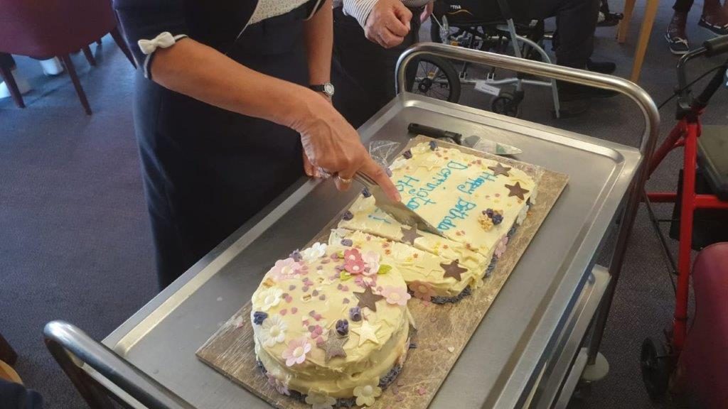 Cutting the birthday cake for Dorrington House Watton's 20th Birthday!